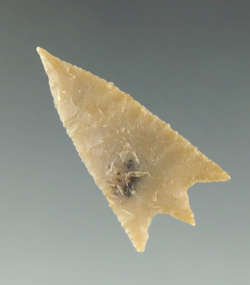 Incredibly well made 1 1/8" Bassett Point with high quality flaking. Found in Texas.