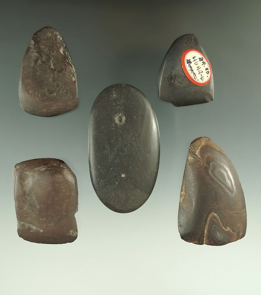 Set of four Hematite Celts in a partially drilled Pebble Pendant found at Brown's island.