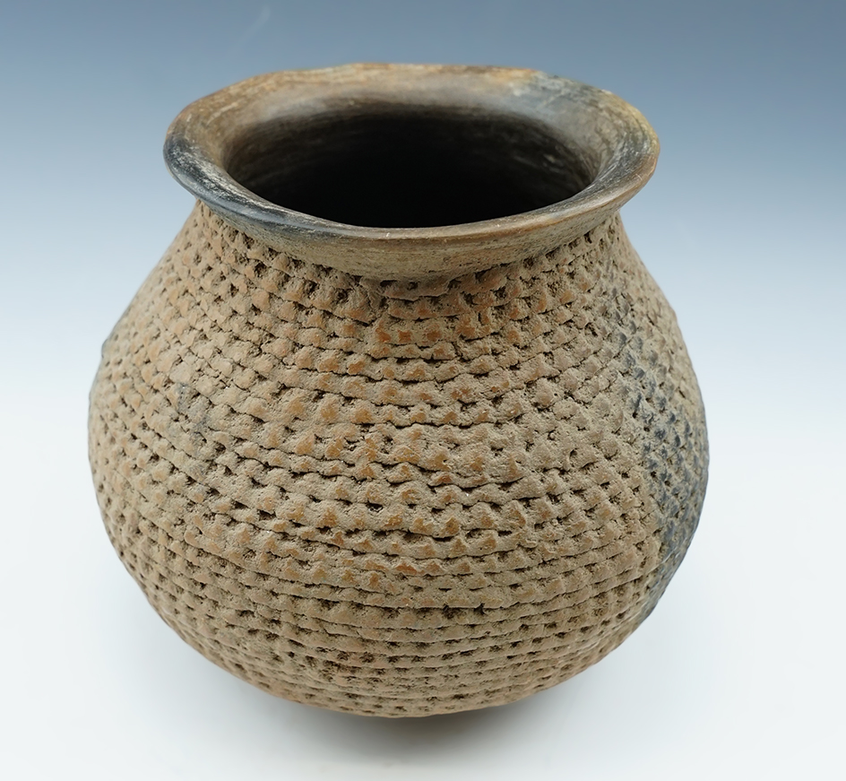 Beautiful exterior design on this 5 1/2" tall x 5 3/4" wide  Prehistoric pottery vessel found in New