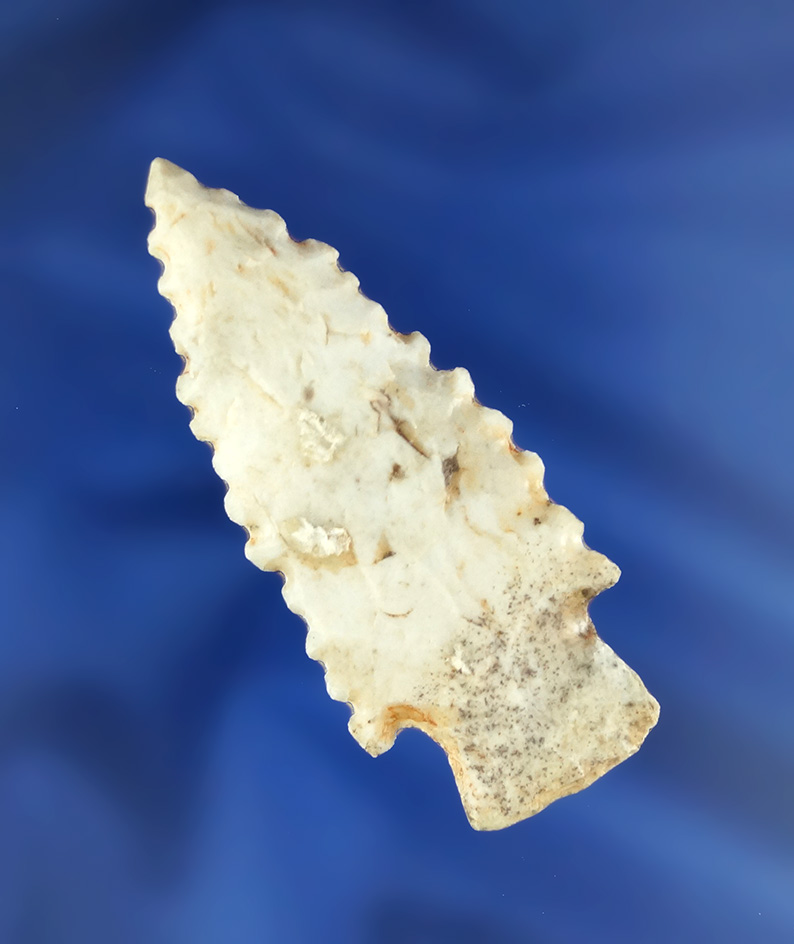 Heavily serrated 2 3/16" Stemmed Dart Point found in the Midwest.