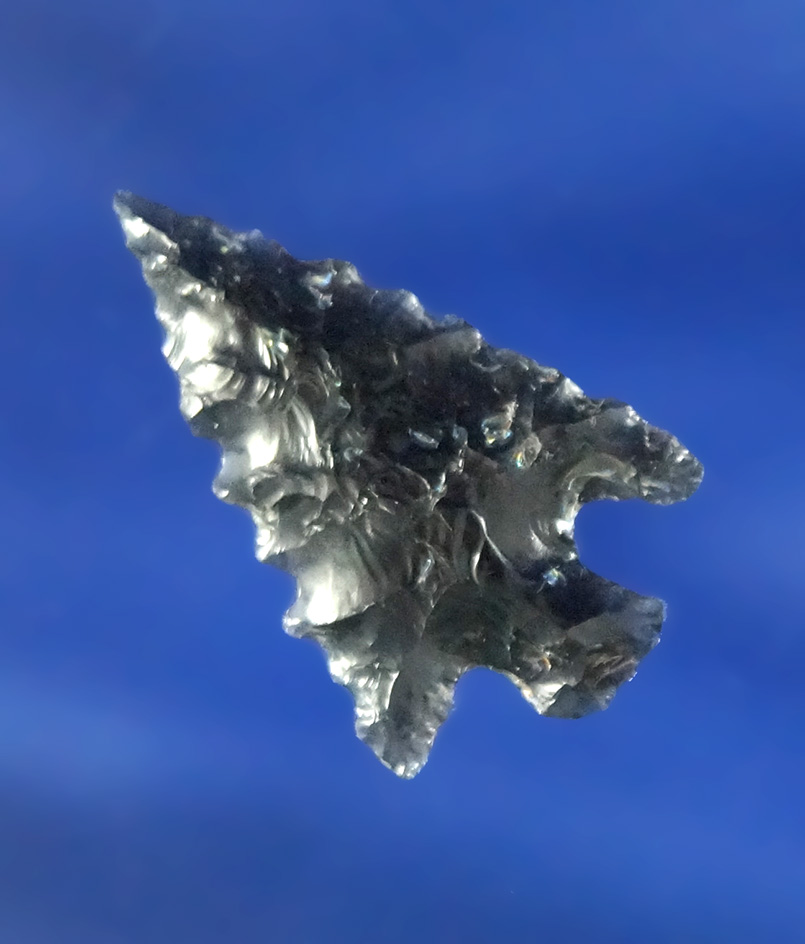 nicely serrated 7/8" Rose Springs Corner Notch made from Obsidian found in Oregon.