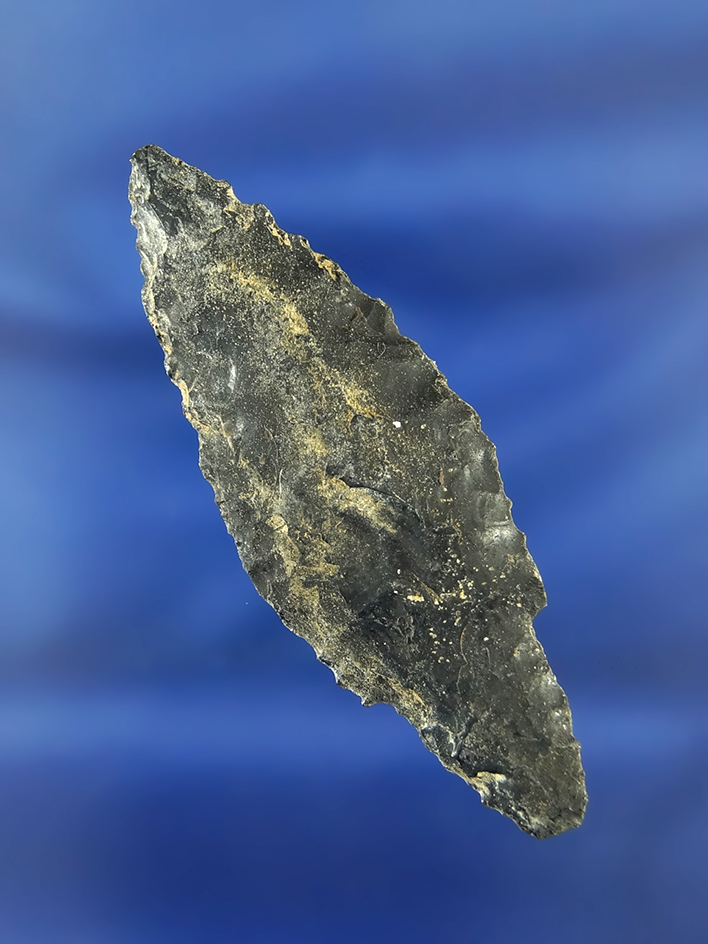 Heavily patinated Obsidian Stemmed point found in the great basin region.