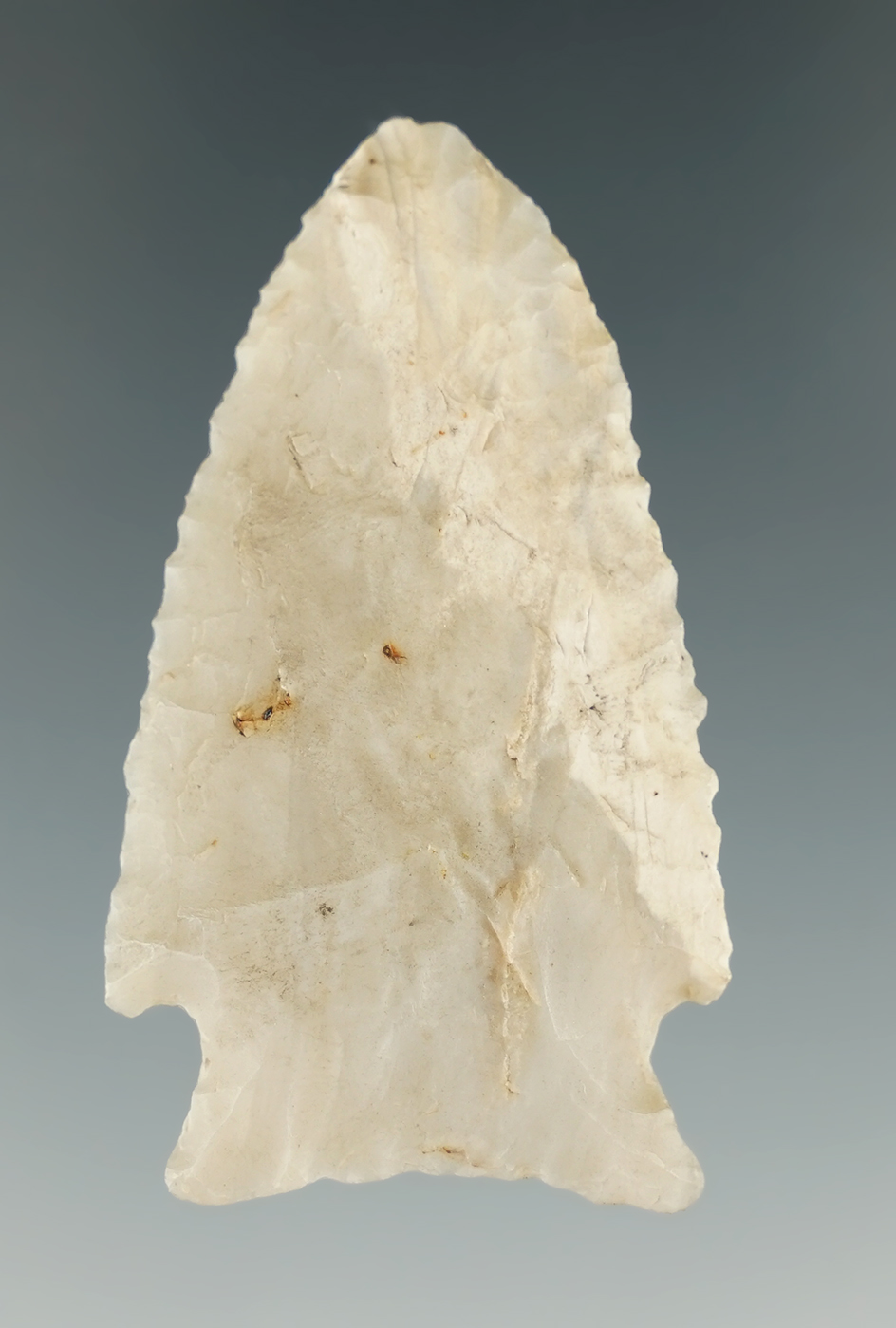Excellent flaking on this 2 1/16" Cornernotch point made from semi translucent material - Missouri.