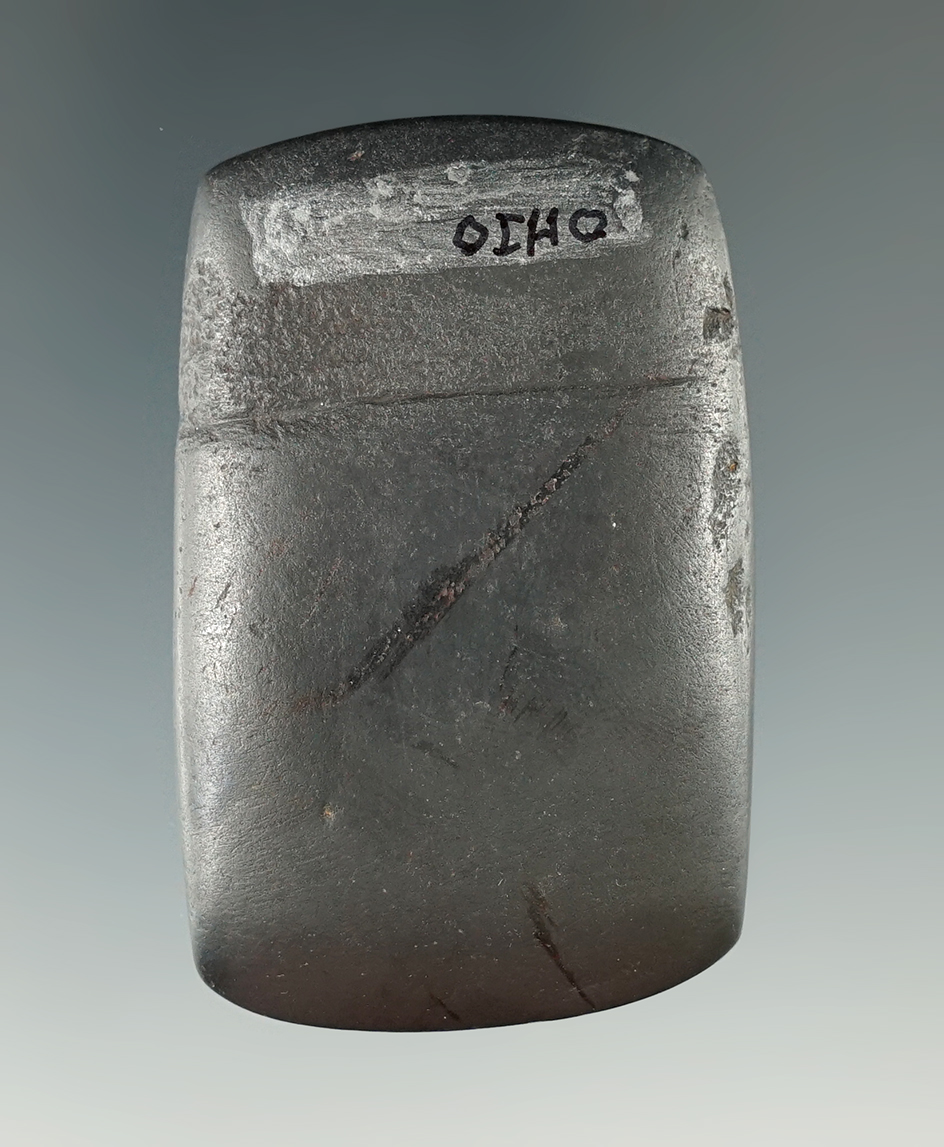 Lightly grooved 2 1/16" Hematite Celt that is well polished found in Ohio.