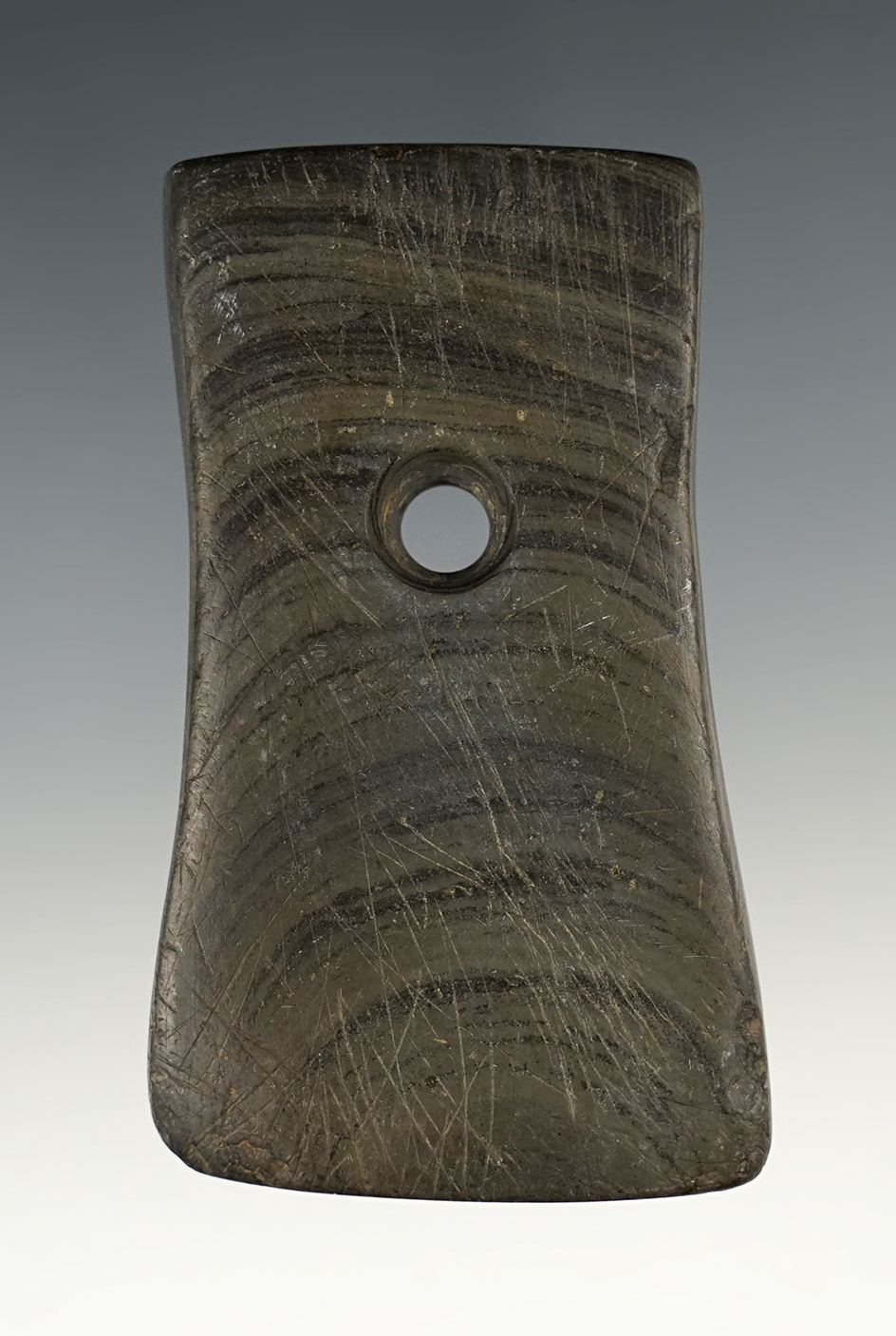 3 1/16" Adena Bell Pendant made from green and black Mottled Slate. Found in Erie Co., Ohio.