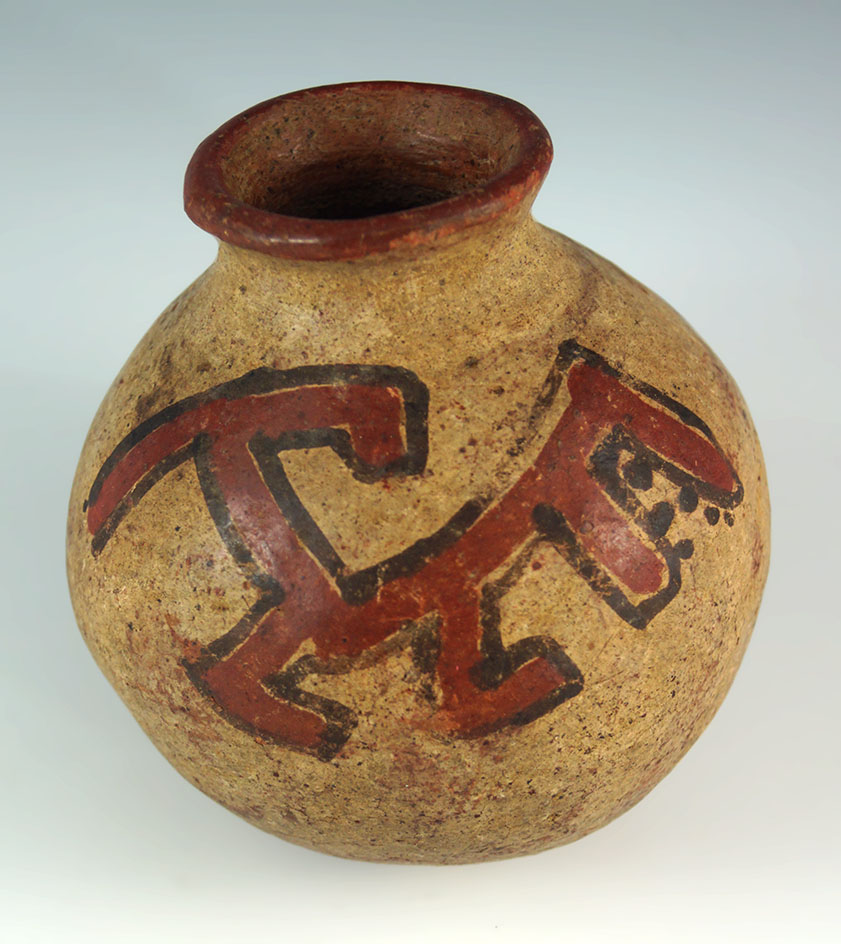 Red on buff Olla with an abstract image of a toothy monster. Solid condition, 3 1/8" by 3 3/8".