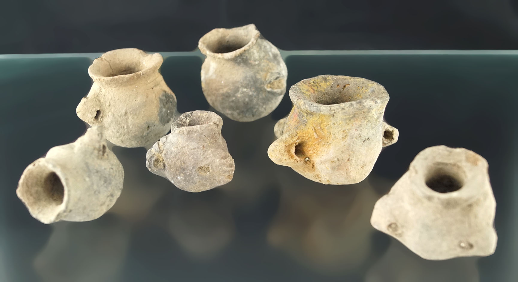 Unique set of six pre-Columbian miniature pottery vessels, largest is 1 7/8" tall.