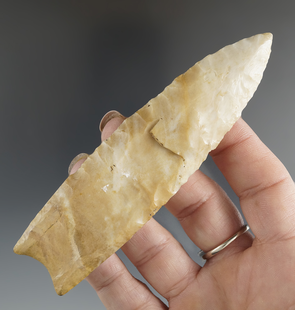 4 7/16" Paleo fluted Clovis found in Tisilwa, IL. Restoration to 5/8" of base. 2 COAs.