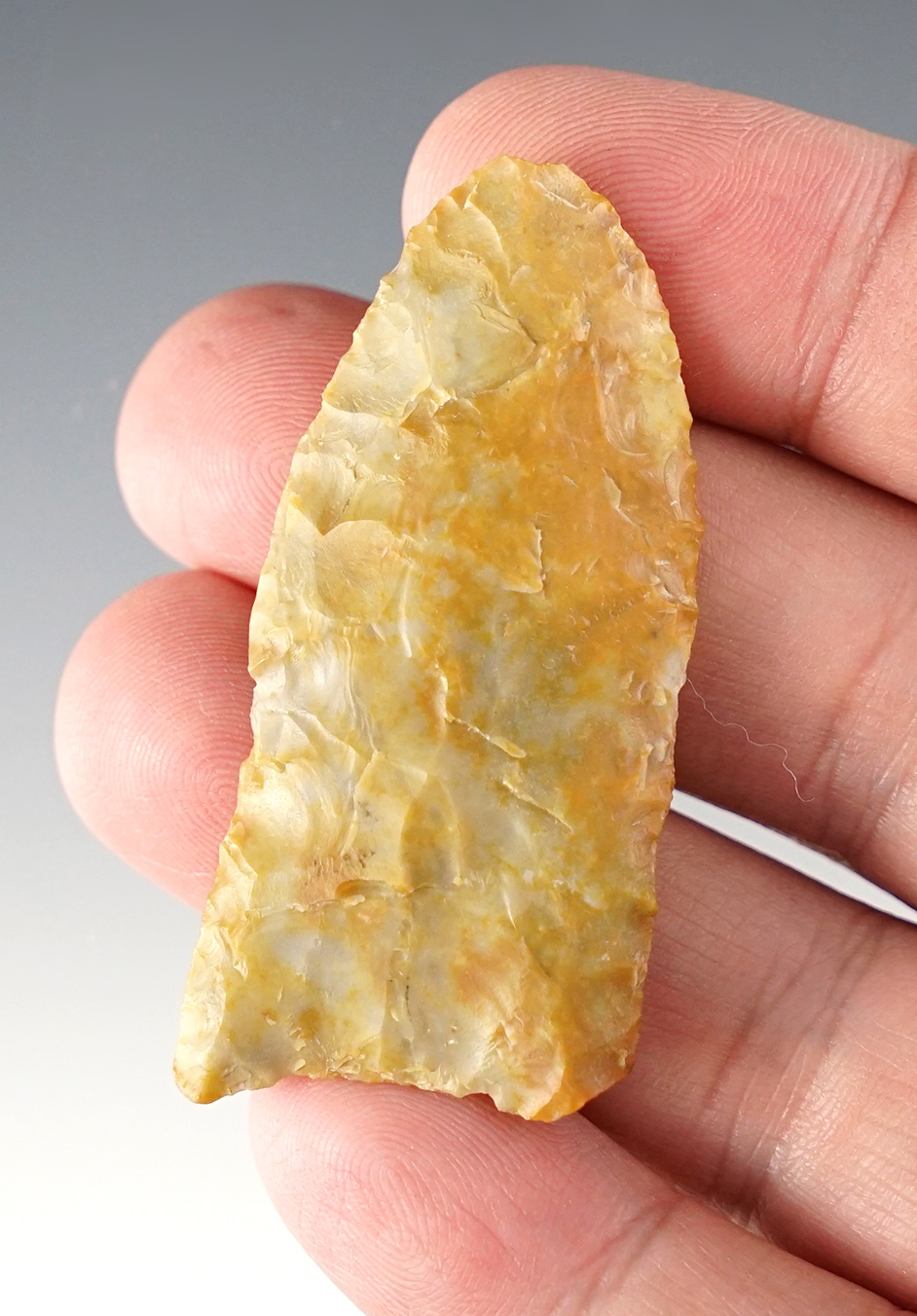 2 3/16" heavily patinated Paleo Point made from colorful flint.