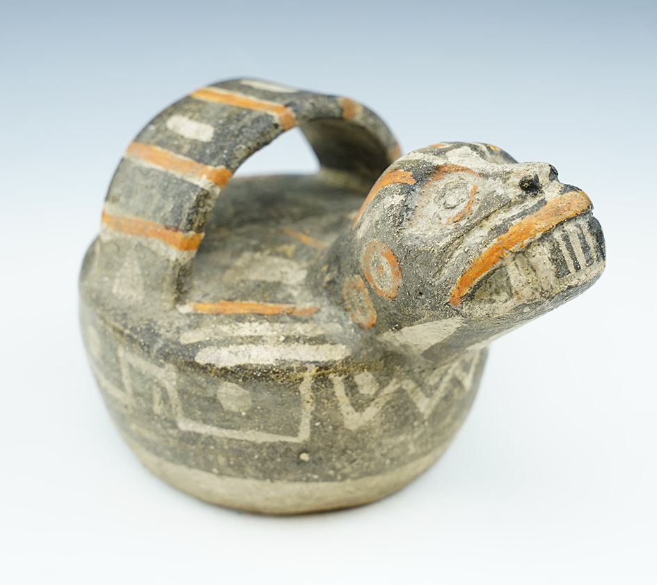 5 3/4" by  3 1/4" rare coastal Huari Effigy Bottle that is nicely painted.