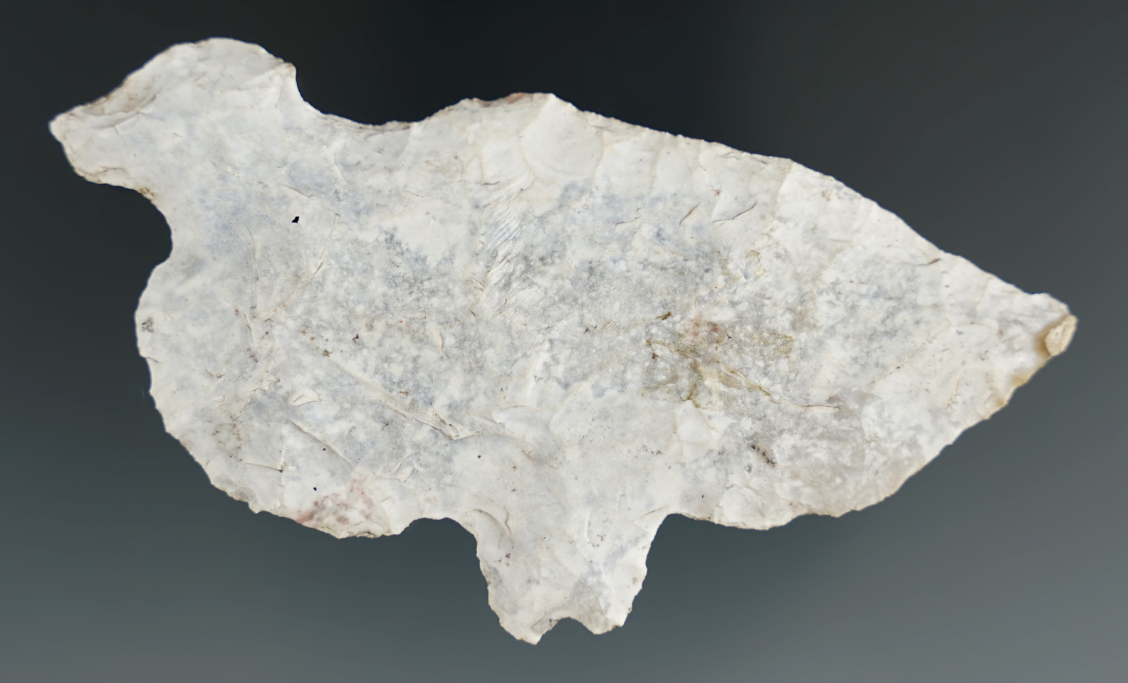 Heavily patinated 3 3/8" long flint Mayan eccentric found in Belize.