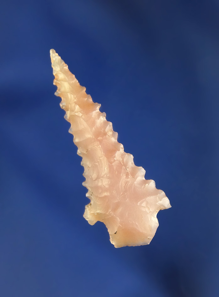 1 3/8" highly serrated pink agate arrowhead found in Lynn County Oregon by Robert Howard.