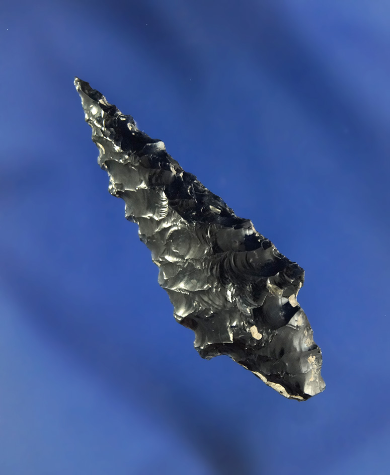 Nicely serrated 1 3/4" Obsidian Rabbit Island dart point found near Crump Lake Oregon.