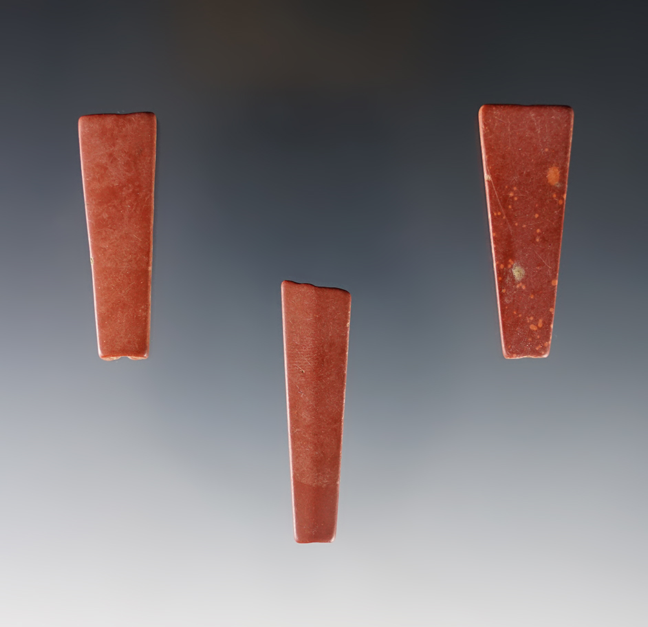 Set of three trapezoidal micro-drilled red slate and Catlinite beads. Townley-Read site, NY.