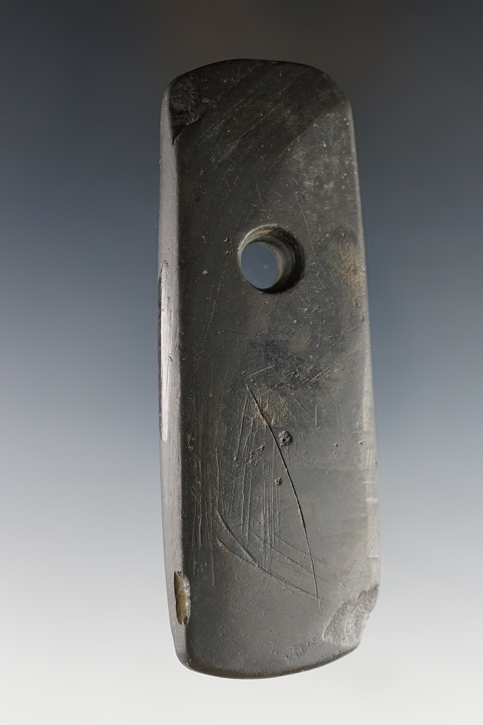 3 13/16" Pendant found in Knox Co., Ohio. Made from well patinated black slate. Ex. Wehrle.