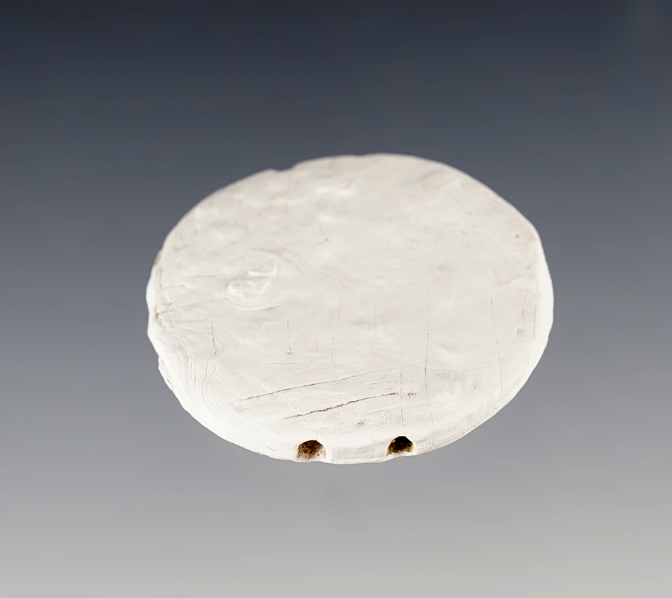 1 3/4" Double Drilled Marine Shell Runtee that is very well patinated. Union Springs, New York.