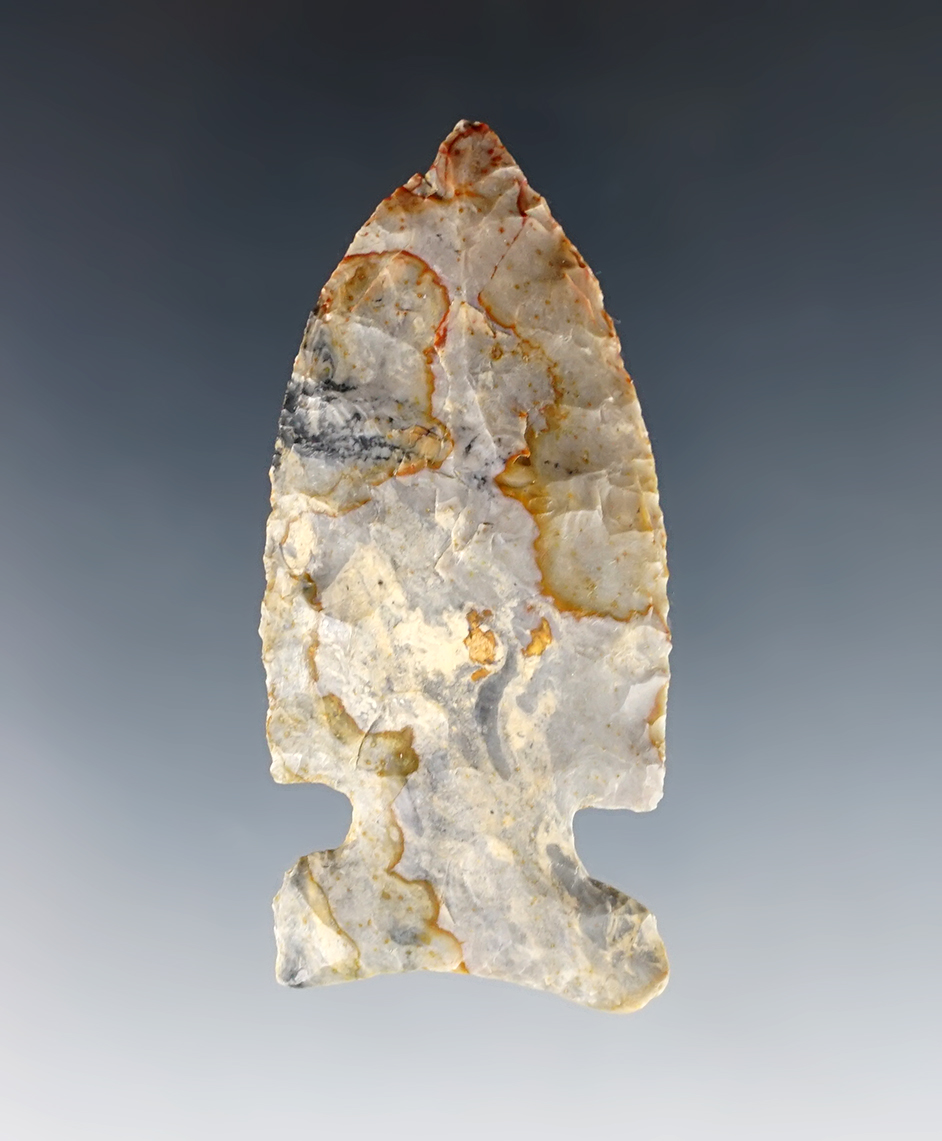 2 1/2" highly colored Archaic Sidenotch - Coshocton Flint with nice streaks of red. Crawford Co., Ohio.