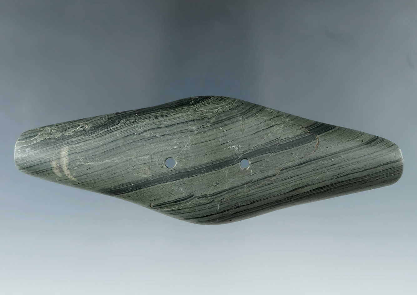 5 1/4" Adena Expanded Center Gorget found in Scioto Co., Ohio. Beautiful material banding. Pictured.