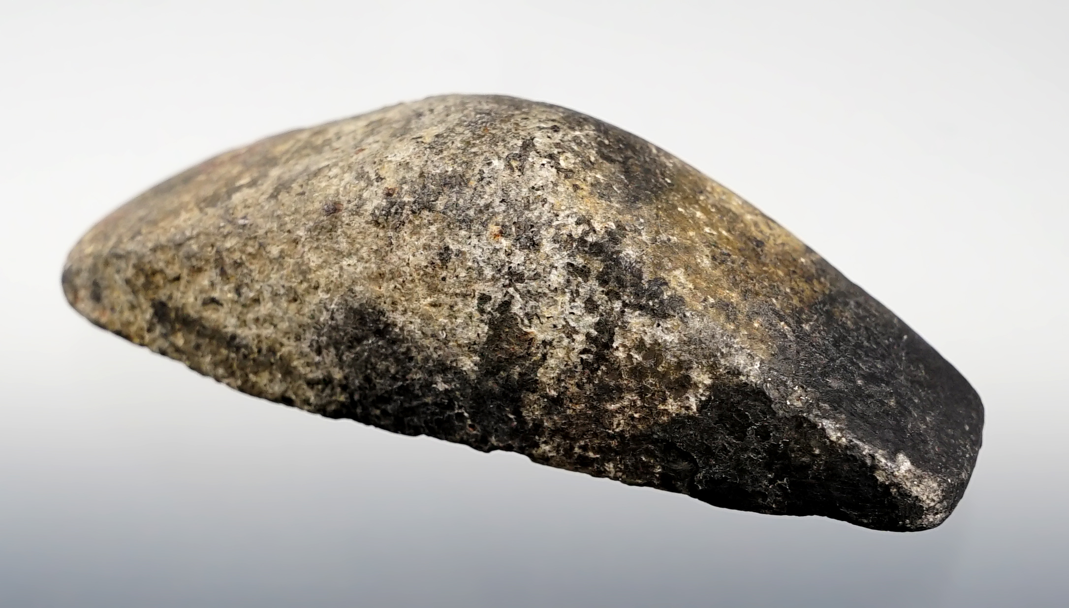 3 1/4" slightly scooped Boatstone made from Hardstone. Licking Co., Ohio. Ex. Gilbert Dilley.