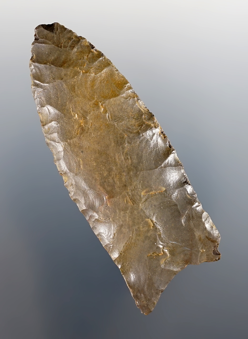 2 13/16" Fluted Paleo Clovis found in the Ohio area. Classic grinding to the lower blade edges. 