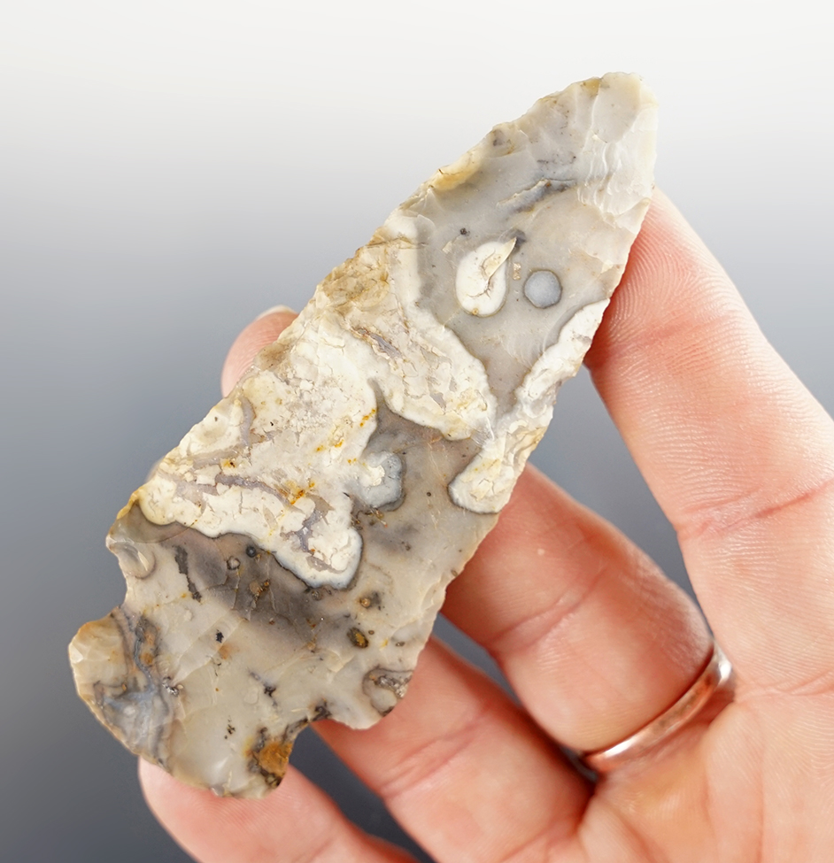 3 1/4" Ohio Hopewell made from exotic colored Flint Ridge Flint. Comes with a Bennett COA.